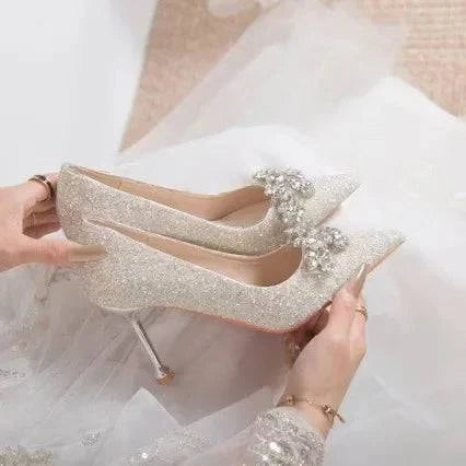 LYNHURD women's pointed toe wedding shoes with crystal accents and high heels, featuring a polyurethane sole and rubber heel.