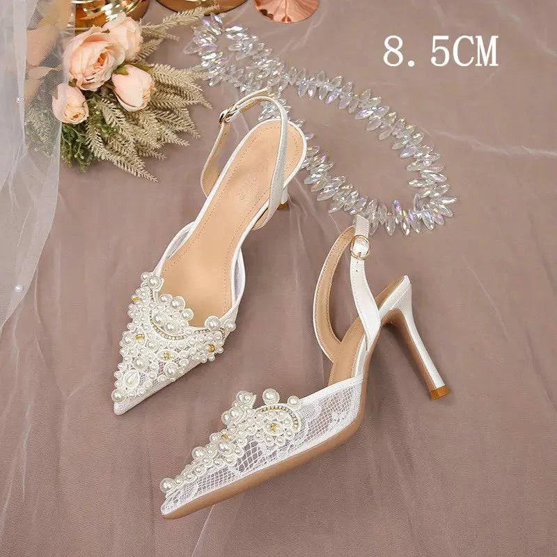 White lace high heel wedding shoes with pearls, ideal for bridesmaids, by LYNHURD. Elegant and stylish design.