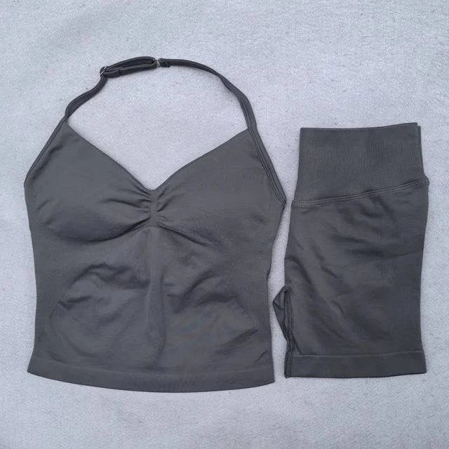 LYNHURD! women's yoga set featuring backless halter tops and high-waist seamless shorts in a gym setting.