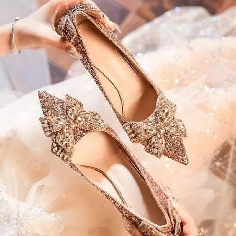 Silver high heels with a bow, pointed toe design, and crystal accents by LYNHURD, perfect for casual or formal wear.