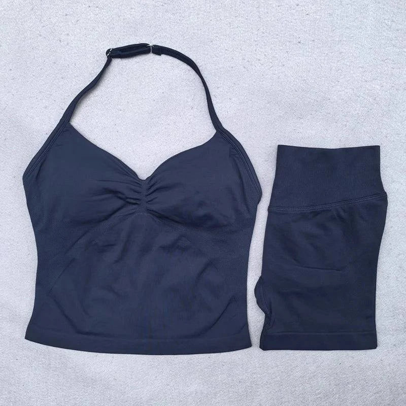 LYNHURD! women's yoga set featuring backless halter tops and high waist seamless shorts in a gym setting.