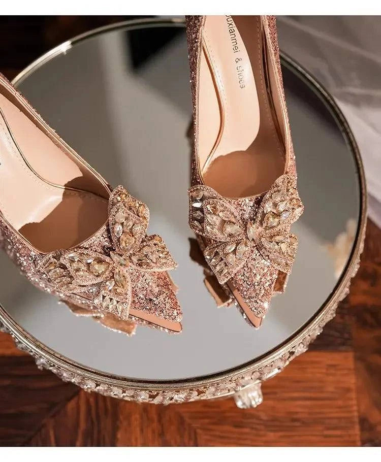 Silver high heels with a pointed toe and bow detail, featuring a shiny finish by LYNHURD! for women’s casual wear.